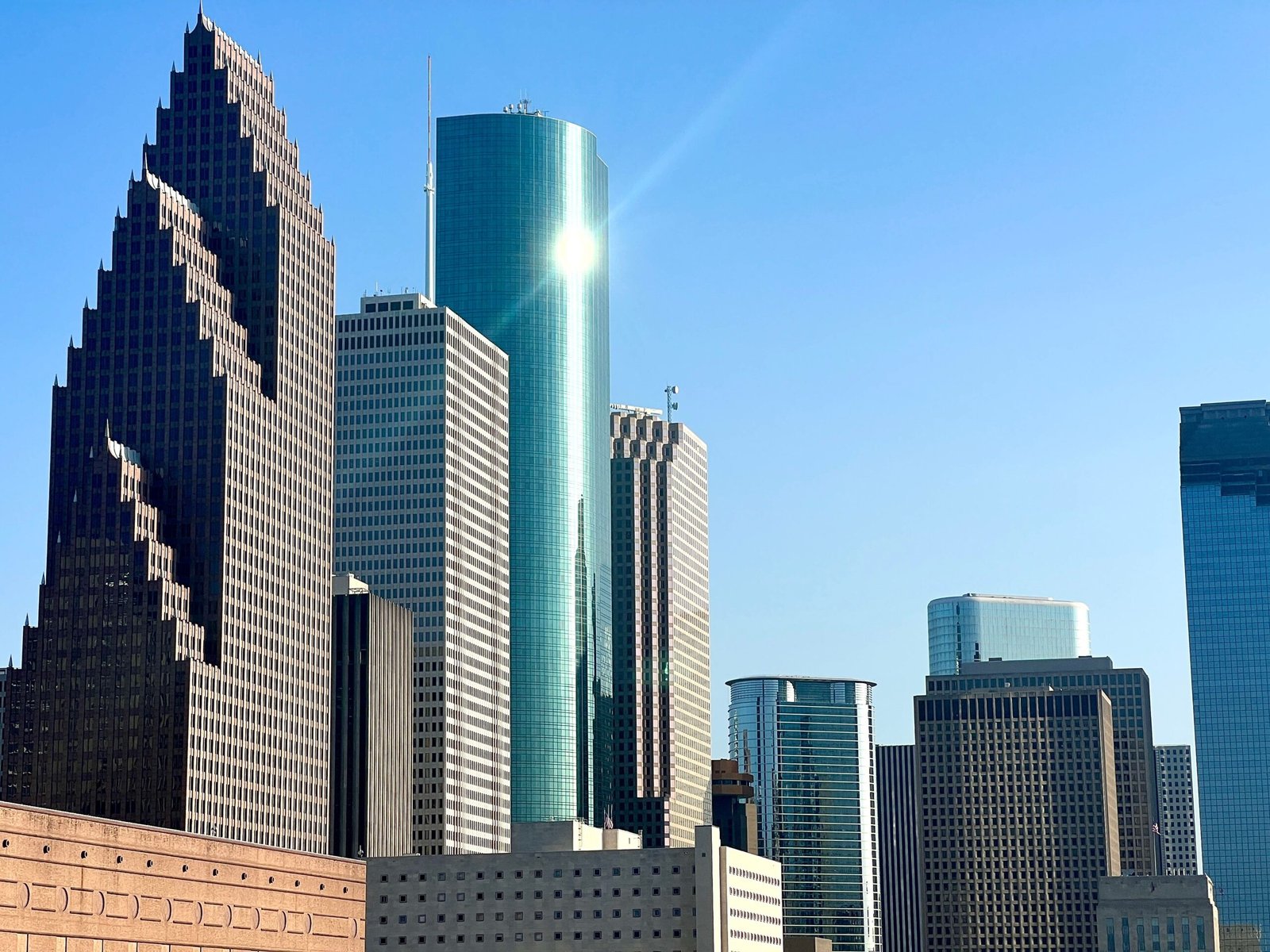 Stunning view of Houston's skyscrapers under clear blue sky.